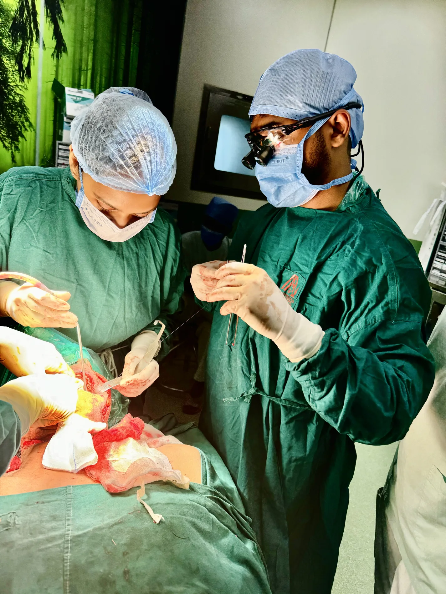 Dr Anup Srinivas performing head and neck cancer surgery with his operating team